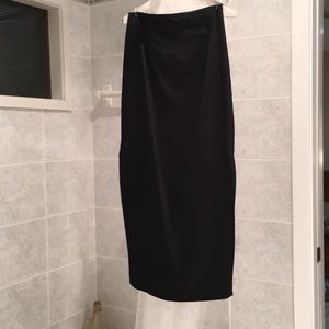 Black satin, long skirt. slit to knee